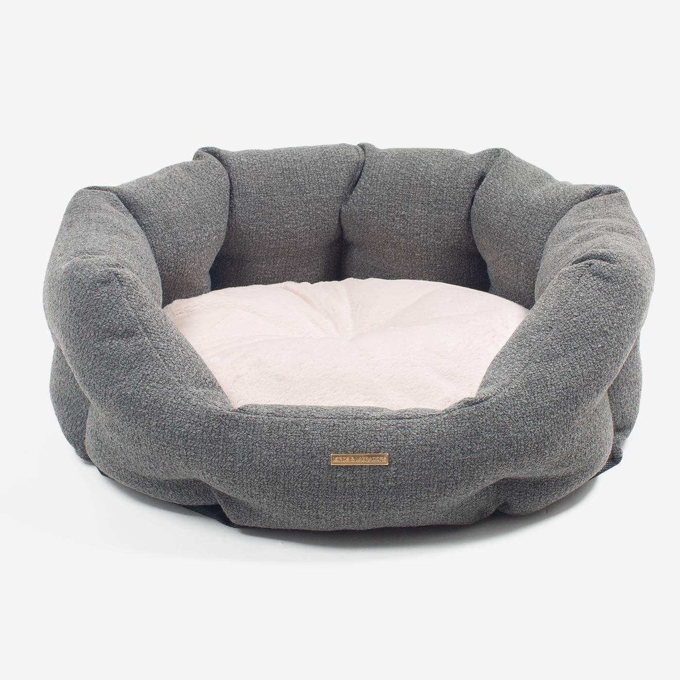Discover our luxury Herdwick oval dog bed in beautiful graphite, the ideal choice for dogs to enjoy blissful nap-time, featuring reversible inner cushion with raised sides for dogs who love to rest their head for the ultimate cosiness! Handcrafted in Italy for pure pet luxury! Available now at Lords & Labradors
