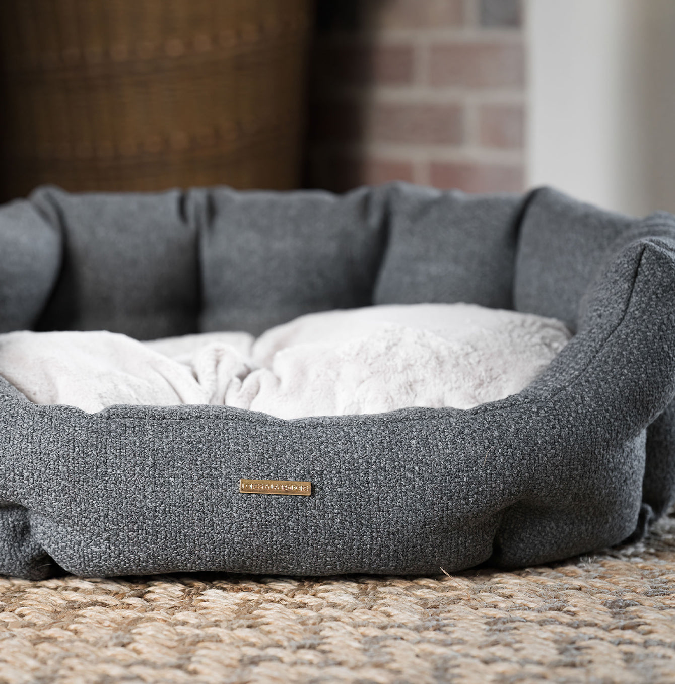 Discover our luxury Herdwick oval dog bed in beautiful graphite, the ideal choice for dogs to enjoy blissful nap-time, featuring reversible inner cushion with raised sides for dogs who love to rest their head for the ultimate cosiness! Handcrafted in Italy for pure pet luxury! Available now at Lords & Labradors