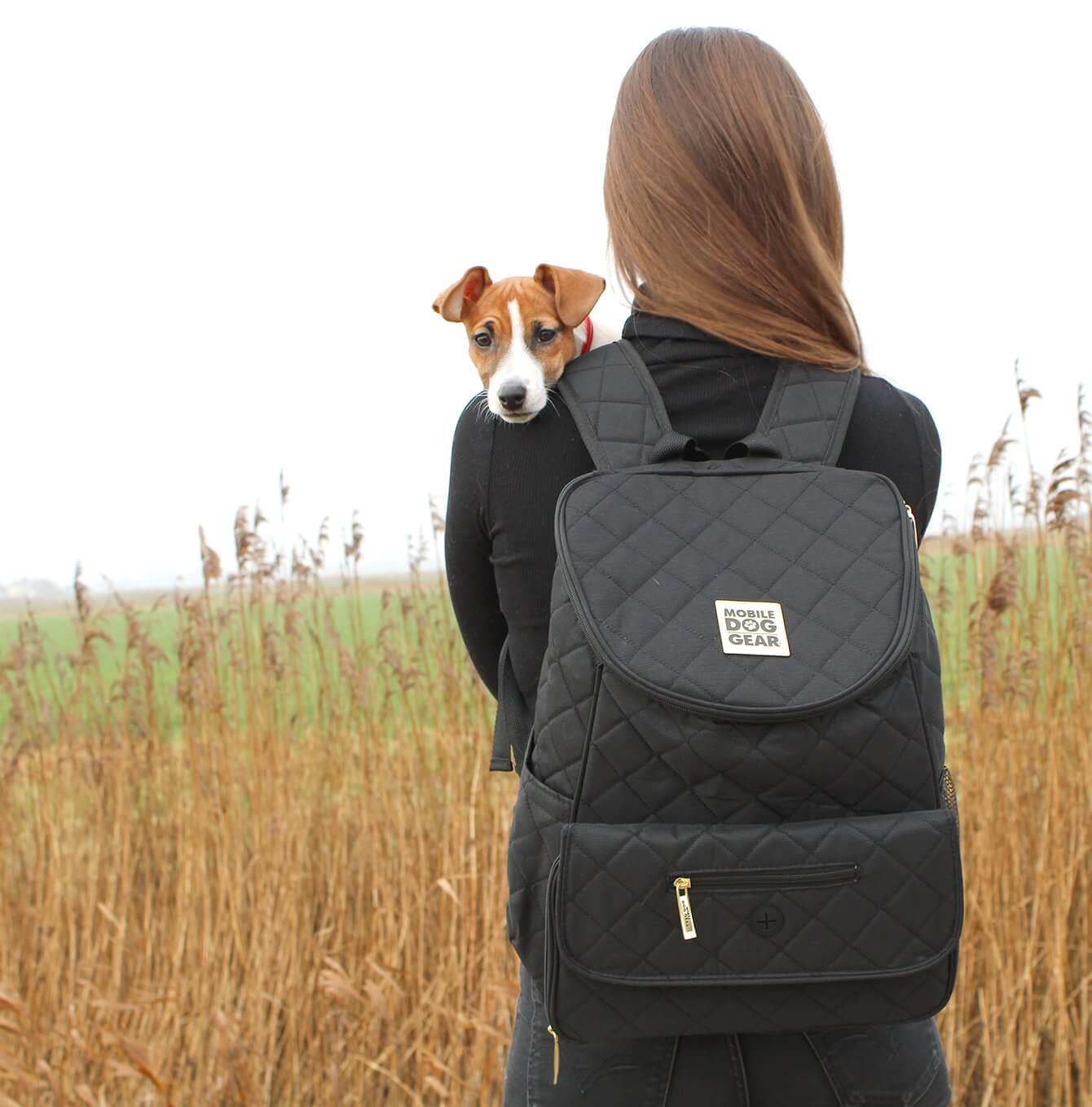 Discover, Mobile Dog Gear Weekender Backpack, in Black. The Perfect Away Bag for any Pet Parent, Featuring dividers to stack food and built in waste bag dispenser. Also Included feeding set, collapsible silicone bowls and placemat! The Perfect Gift For travel, meets airline requirements. Available Now at Lords & Labradors