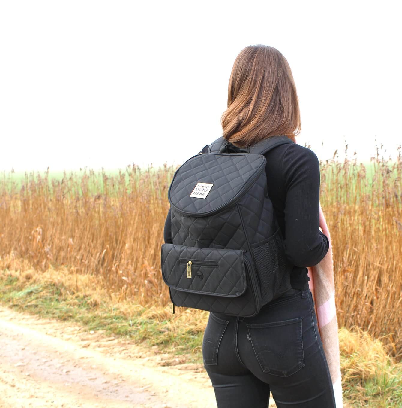 Discover, Mobile Dog Gear Weekender Backpack, in Black. The Perfect Away Bag for any Pet Parent, Featuring dividers to stack food and built in waste bag dispenser. Also Included feeding set, collapsible silicone bowls and placemat! The Perfect Gift For travel, meets airline requirements. Available Now at Lords & Labradors