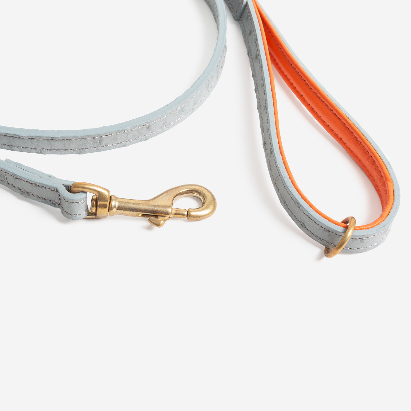 Discover dog walking luxury with our handcrafted Italian Ostrich leather dog Lead in Grey & Orange! The perfect Lead for dogs available now at Lords & Labradors