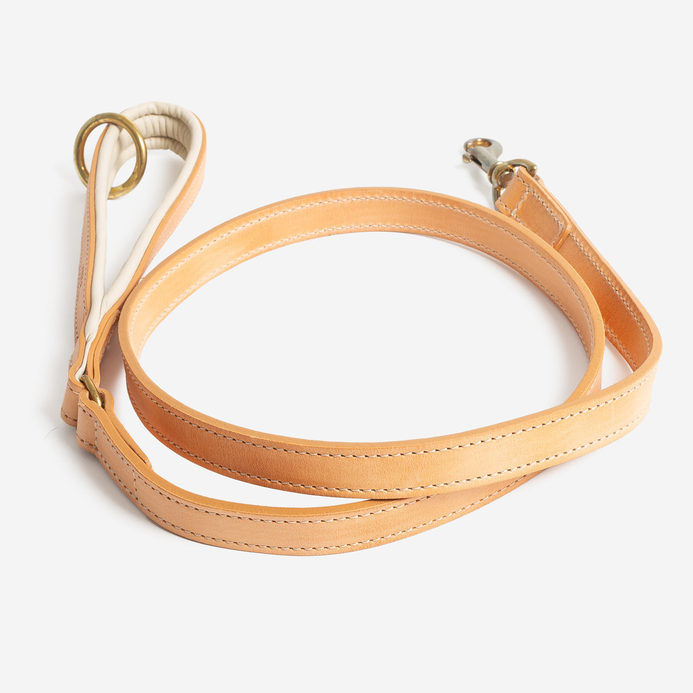 Discover dog walking luxury with our handcrafted Italian padded leather dog Lead in Tan & Cream! The perfect Lead for dogs available now at Lords & Labradors    