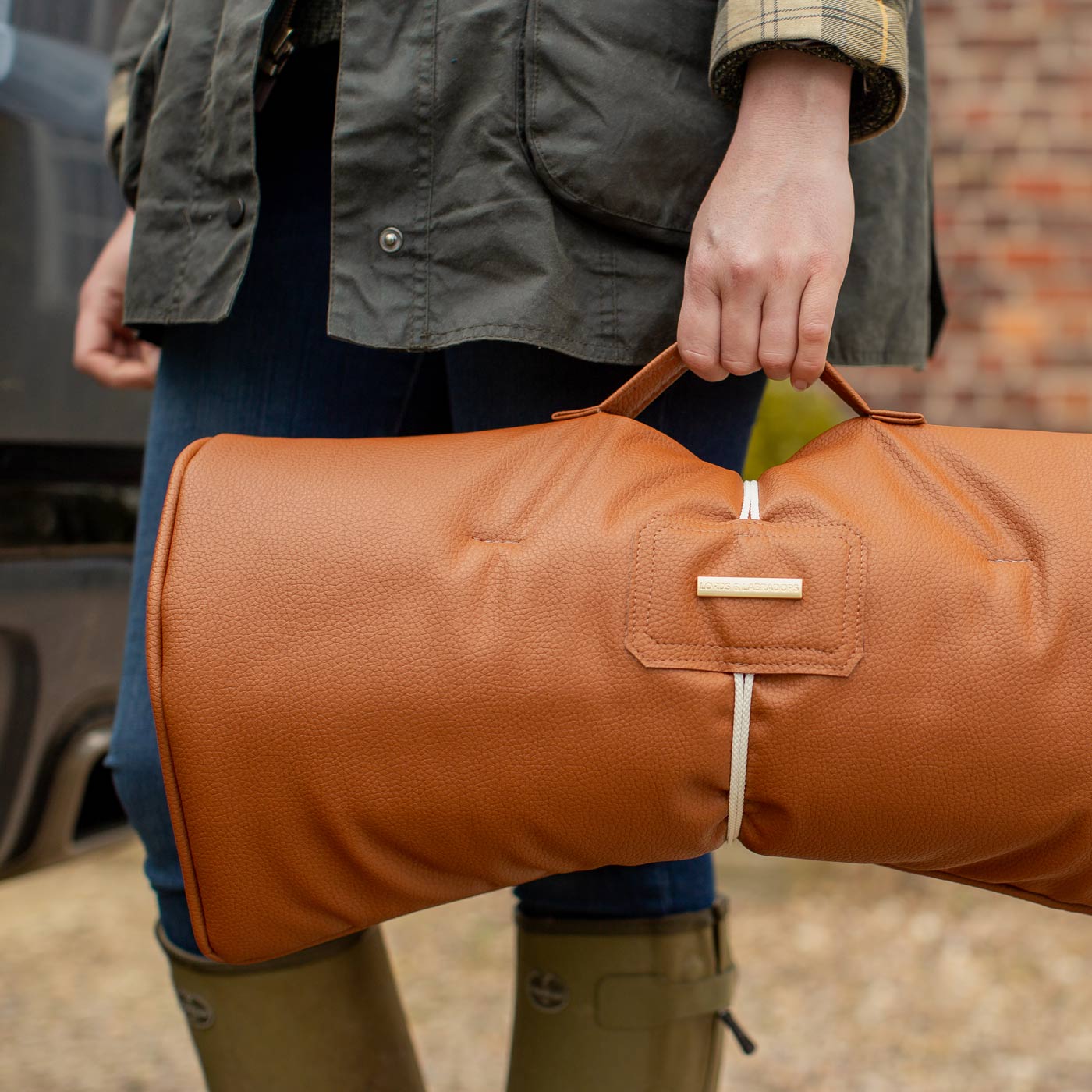 Embark on the perfect pet travel with our luxury Travel Mat in Essentials Rhino Ember. Featuring a Carry handle for on the move once Rolled up for easy storage, can be used as a seat cover, boot mat or travel bed! Available now at Lords & Labradors