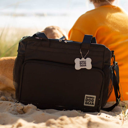 Discover, Mobile Dog Gear Week Away Bag, in Black. The Perfect Away Bag for any Pet Parent, Featuring dividers to stack food and built in waste bag dispenser. Also Included feeding set, collapsible silicone bowls and placemat! The Perfect Gift For travel, meets airline requirements. Available Now at Lords & Labradors