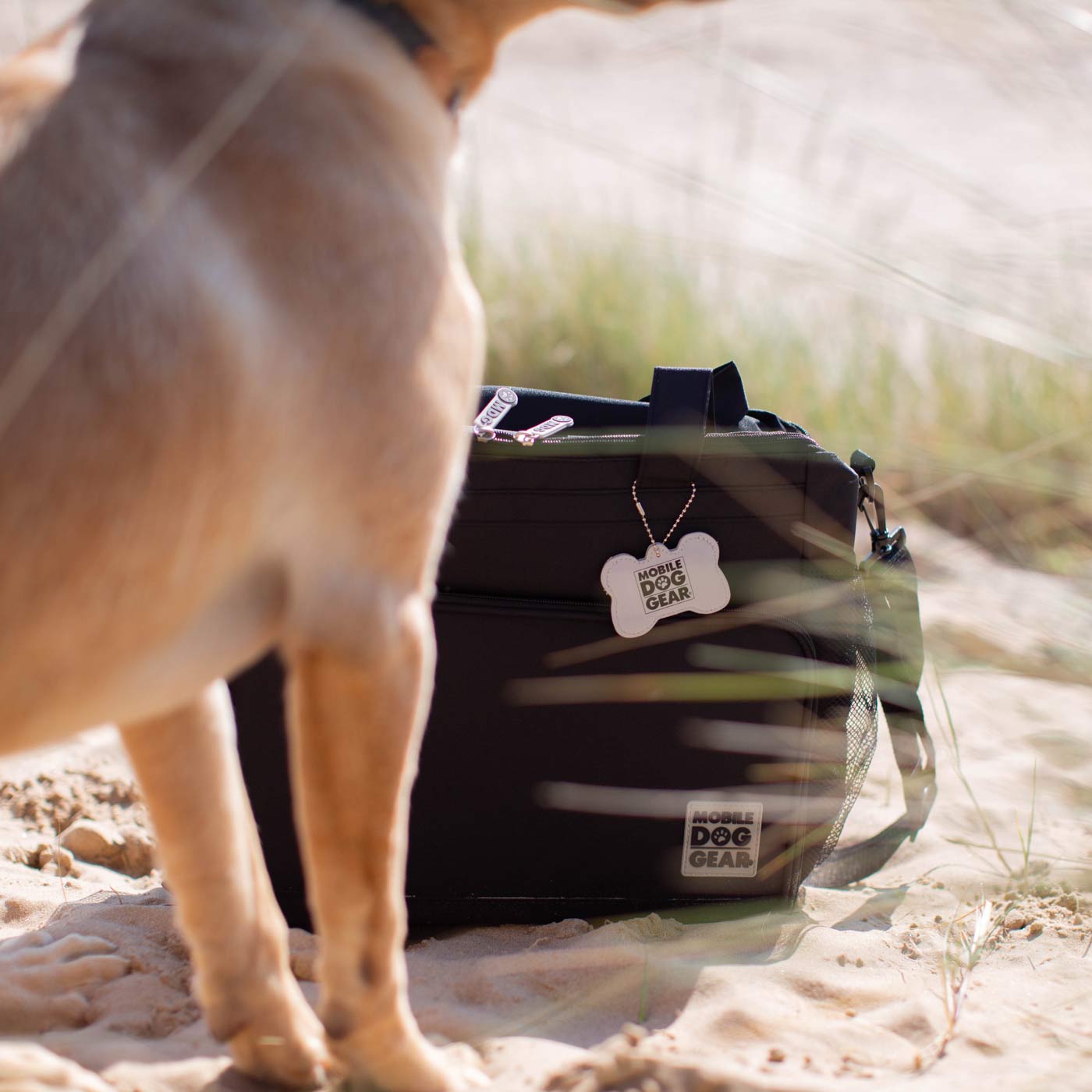 Discover, Mobile Dog Gear Week Away Bag, in Black. The Perfect Away Bag for any Pet Parent, Featuring dividers to stack food and built in waste bag dispenser. Also Included feeding set, collapsible silicone bowls and placemat! The Perfect Gift For travel, meets airline requirements. Available Now at Lords & Labradors