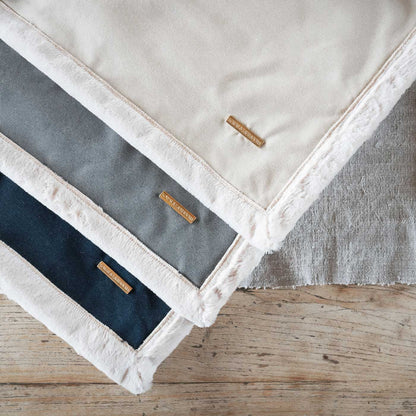 Present your furry friend with our luxuriously thick, plush blanket for your pet. Featuring a reverse side with hardwearing woven fabric handmade in Italy for the perfect high-quality pet blanket! Essentials Twill Blanket In Denim, Available now at Lords & Labradors    