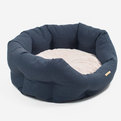 Discover our luxury twill oval dog bed in beautiful Denim, the ideal choice for dogs to enjoy blissful nap-time, featuring reversible inner cushion with raised sides for dogs who love to rest their head for the ultimate cosiness! Handcrafted in Italy for pure pet luxury! Available now at Lords & Labradors 