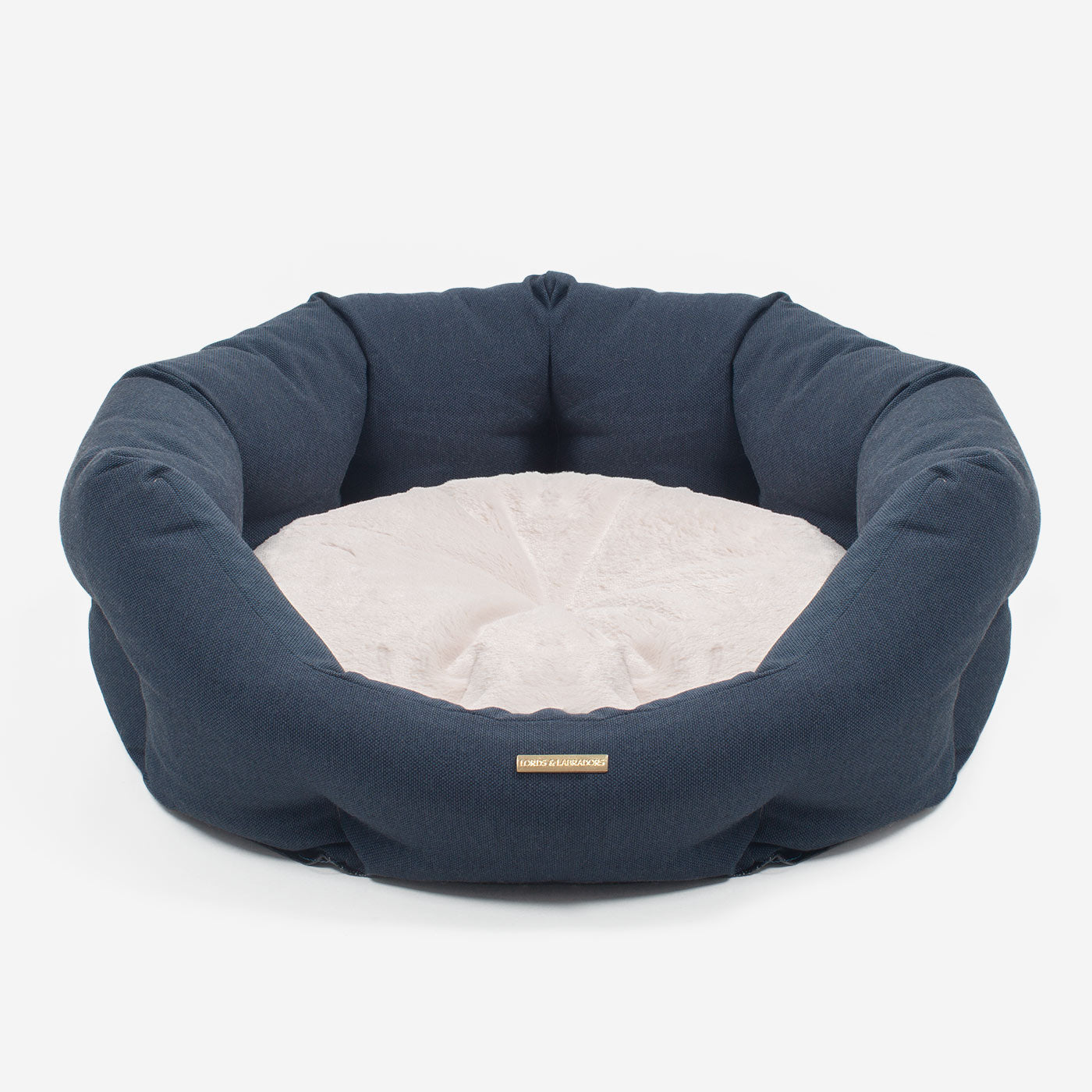 Discover our luxury twill oval dog bed in beautiful Denim, the ideal choice for dogs to enjoy blissful nap-time, featuring reversible inner cushion with raised sides for dogs who love to rest their head for the ultimate cosiness! Handcrafted in Italy for pure pet luxury! Available now at Lords & Labradors 