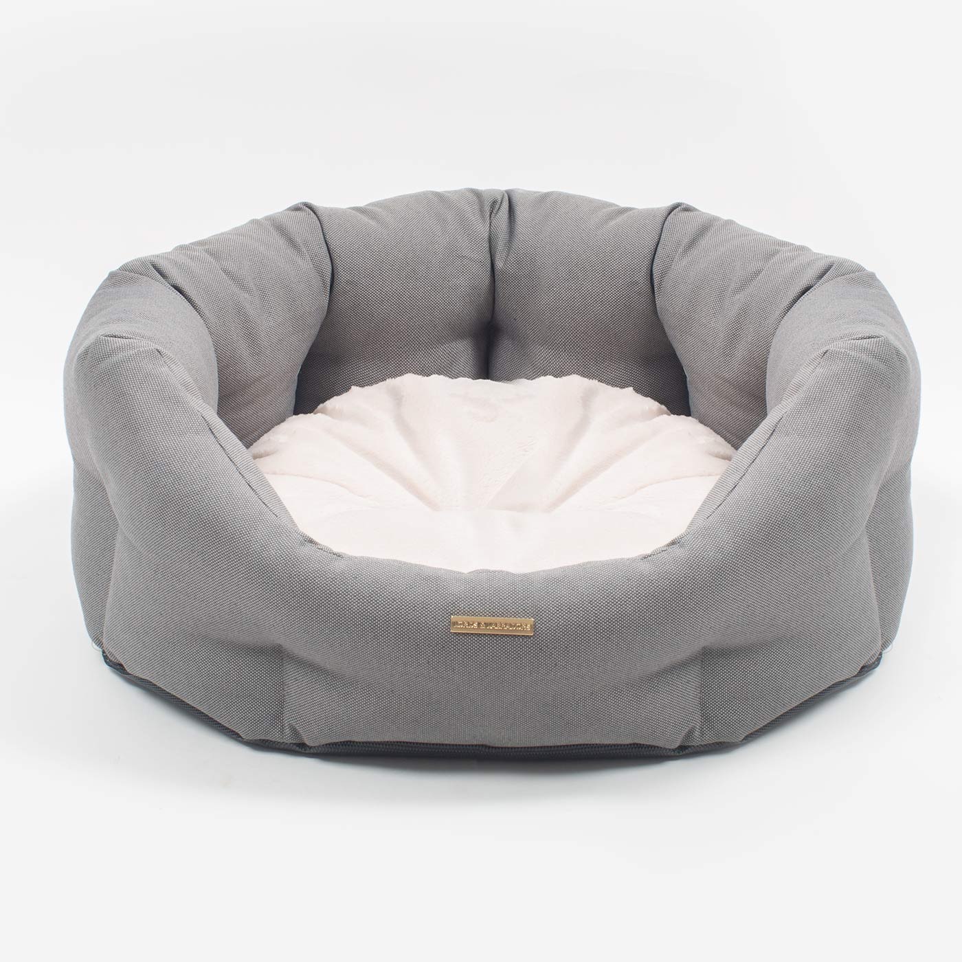 Discover our luxury twill oval dog bed in beautiful sandstone, the ideal choice for dogs to enjoy blissful nap-time, featuring reversible inner cushion with raised sides for dogs who love to rest their head for the ultimate cosiness! Handcrafted in Italy for pure pet luxury! Available now at Lords & Labradors    