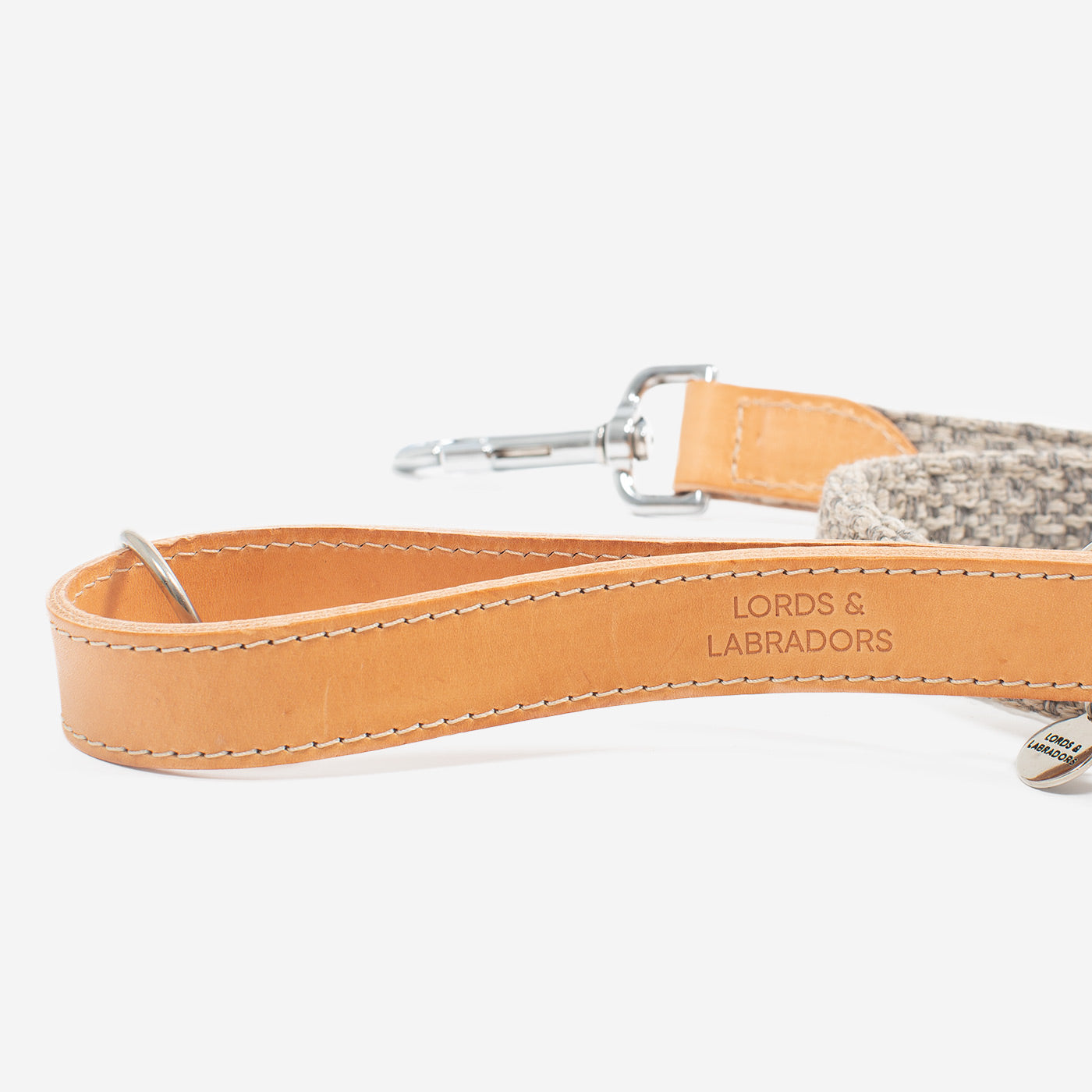 Discover dog walking luxury with our handcrafted Italian Herdwick dog lead in beautiful pebble with woven light grey fabric! The perfect lead for dogs available now at Lords & Labradors 