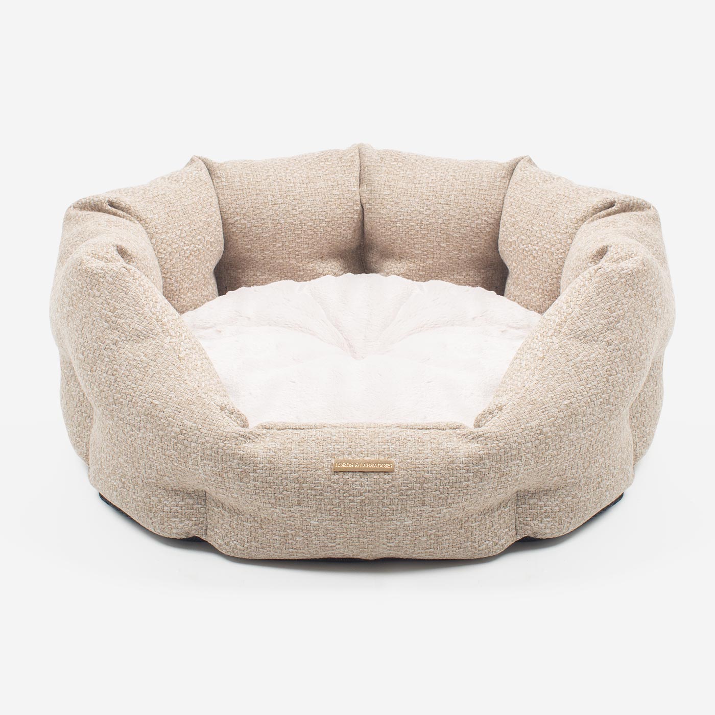 Discover our luxury Herdwick oval dog bed in beautiful sandstone, the ideal choice for dogs to enjoy blissful nap-time, featuring reversible inner cushion with raised sides for dogs who love to rest their head for the ultimate cosiness! Handcrafted in Italy for pure pet luxury! Available now at Lords & Labradors    