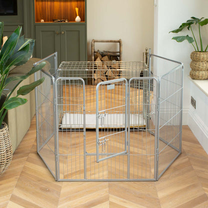 Ensure The Ultimate Puppy Safety with Our Heavy Duty 80cm High Silver Metal Play Pen, Crafted to Take Your Pet Right Through Maturity! Powder Coated to Be Extra Hardwearing! 6 panels that are 80cm high and attachments to connect to any crate. The modular system allows you to change the puppy pen shape with multiple layouts! Available To Now at Lords & Labradors    