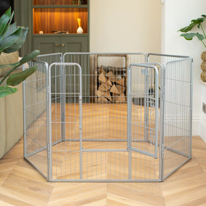 Ensure The Ultimate Puppy Safety with Our Heavy Duty 80cm High Silver Metal Play Pen, Crafted to Take Your Pet Right Through Maturity! Powder Coated to Be Extra Hardwearing! 6 panels that are 80cm high and attachments to connect to any crate. The modular system allows you to change the puppy pen shape with multiple layouts! Available To Now at Lords & Labradors    