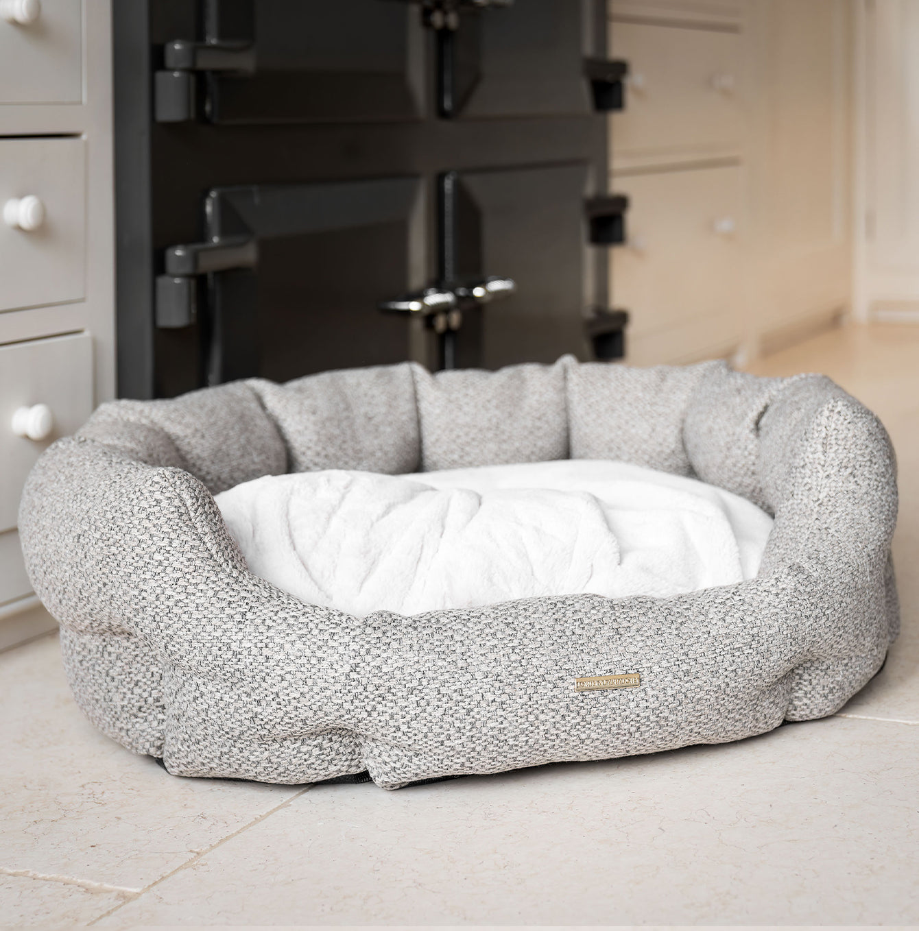 Discover our luxury Herdwick oval dog bed in beautiful pebble, the ideal choice for dogs to enjoy blissful nap-time, featuring reversible inner cushion with raised sides for dogs who love to rest their head for the ultimate cosiness! Handcrafted in Italy for pure pet luxury! Available now at Lords & Labradors 