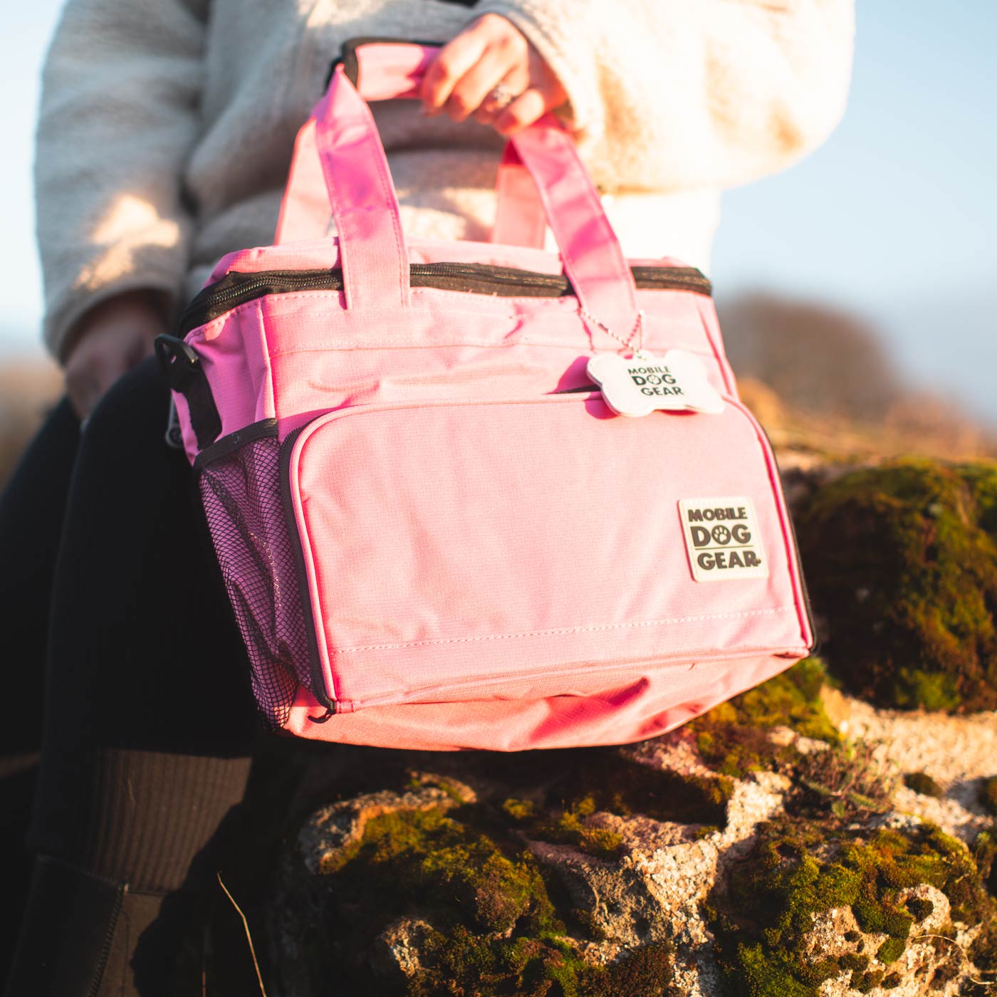 Discover, Mobile Dog Gear Week Away Bag, in Pink. The Perfect Away Bag for any Pet Parent, Featuring dividers to stack food and built in waste bag dispenser. Also Included feeding set, collapsible silicone bowls and placemat! The Perfect Gift For travel, meets airline requirements. Available Now at Lords & Labradors