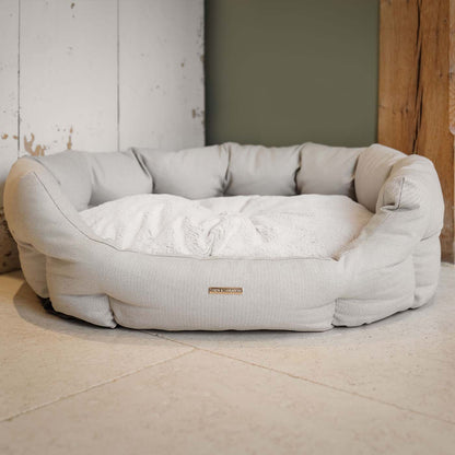 Discover our luxury twill oval dog bed in beautiful Linen, the ideal choice for dogs to enjoy blissful nap-time, featuring reversible inner cushion with raised sides for dogs who love to rest their head for the ultimate cosiness! Handcrafted in Italy for pure pet luxury! Available now at Lords & Labradors 