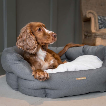 Discover our luxury twill oval dog bed in beautiful sandstone, the ideal choice for dogs to enjoy blissful nap-time, featuring reversible inner cushion with raised sides for dogs who love to rest their head for the ultimate cosiness! Handcrafted in Italy for pure pet luxury! Available now at Lords & Labradors    